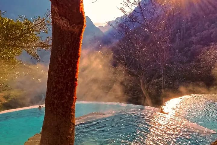 Steam rising from Tolantongo hot springs at golden hour